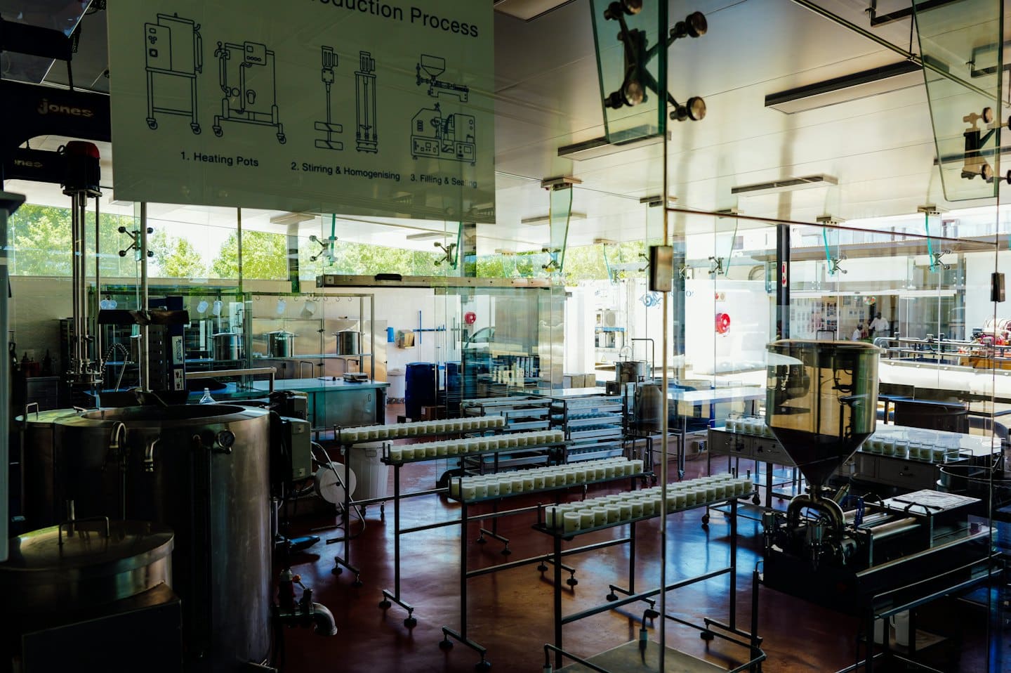 Stainless steel food production equipment in a modern factory.